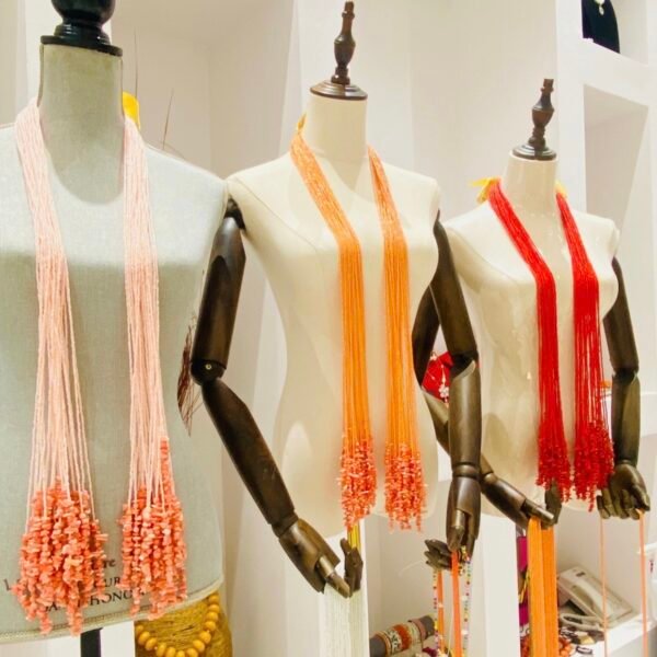 Esther of Kish tie coral necklaces on mannequins